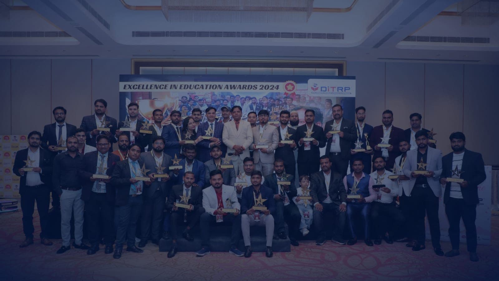 Winners of the 2024 DITRP awards on stage with their trophies